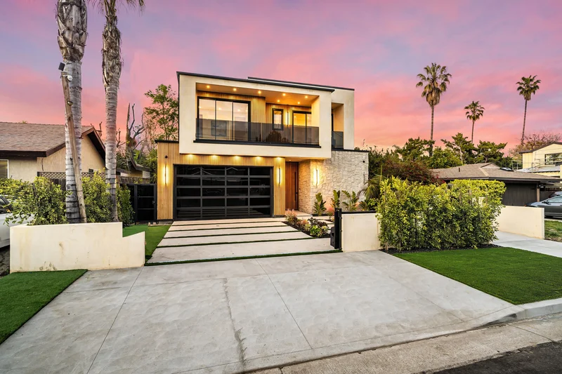 Modern home with clean landscape installation at sunset. Modern home with clean landscape installation at sunset.